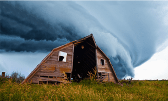 tornado behind a barn