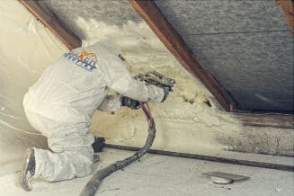 Foam Insulation being sprayed by Baker Roofing & Construction