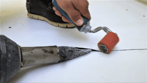 Sealing a TPO seam with hot air weld