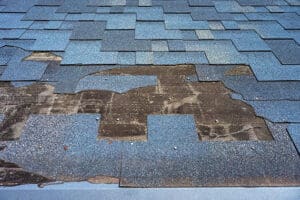 damaged roof shingle repair needed