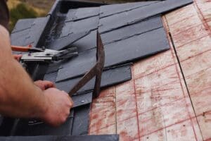 Slate roof being installed on house