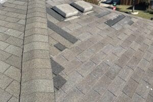 Badly damaged roof with poor temp repairs