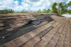 old roof with severe wind damage