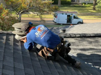 Close-up of roof underlayment and flashing installation layers